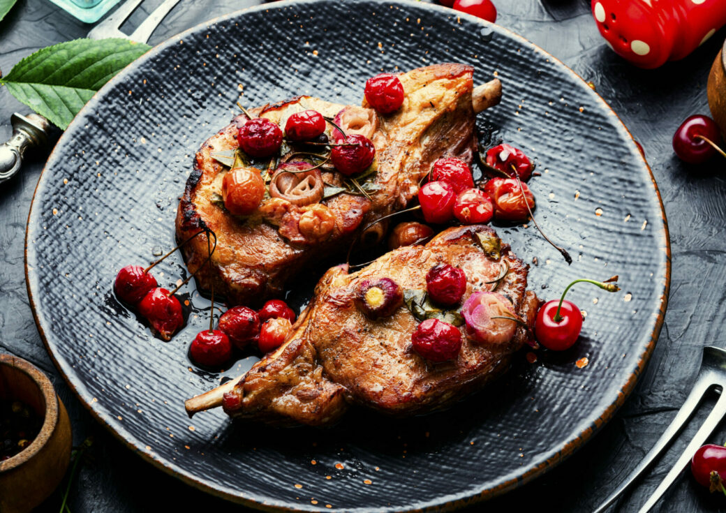 Pork steak on the bone roast in berry marinate